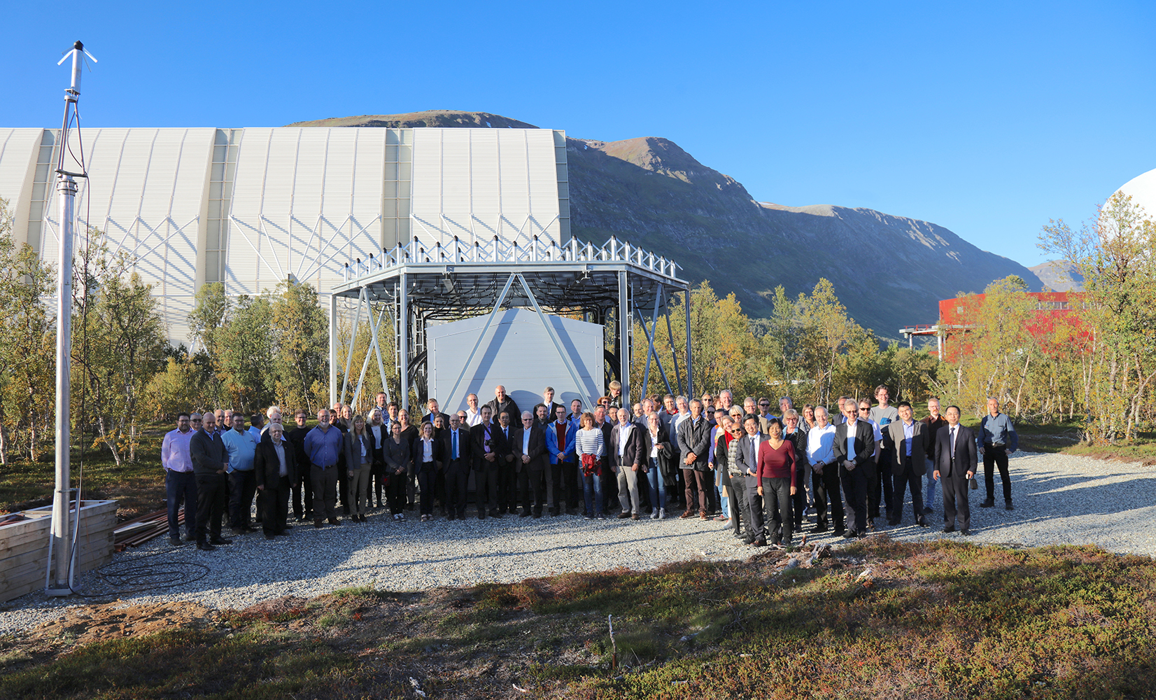 Group photo of EISCAT_3D kick-off participants infront of the EISCAT_3D test site in Ramfjordmoen.