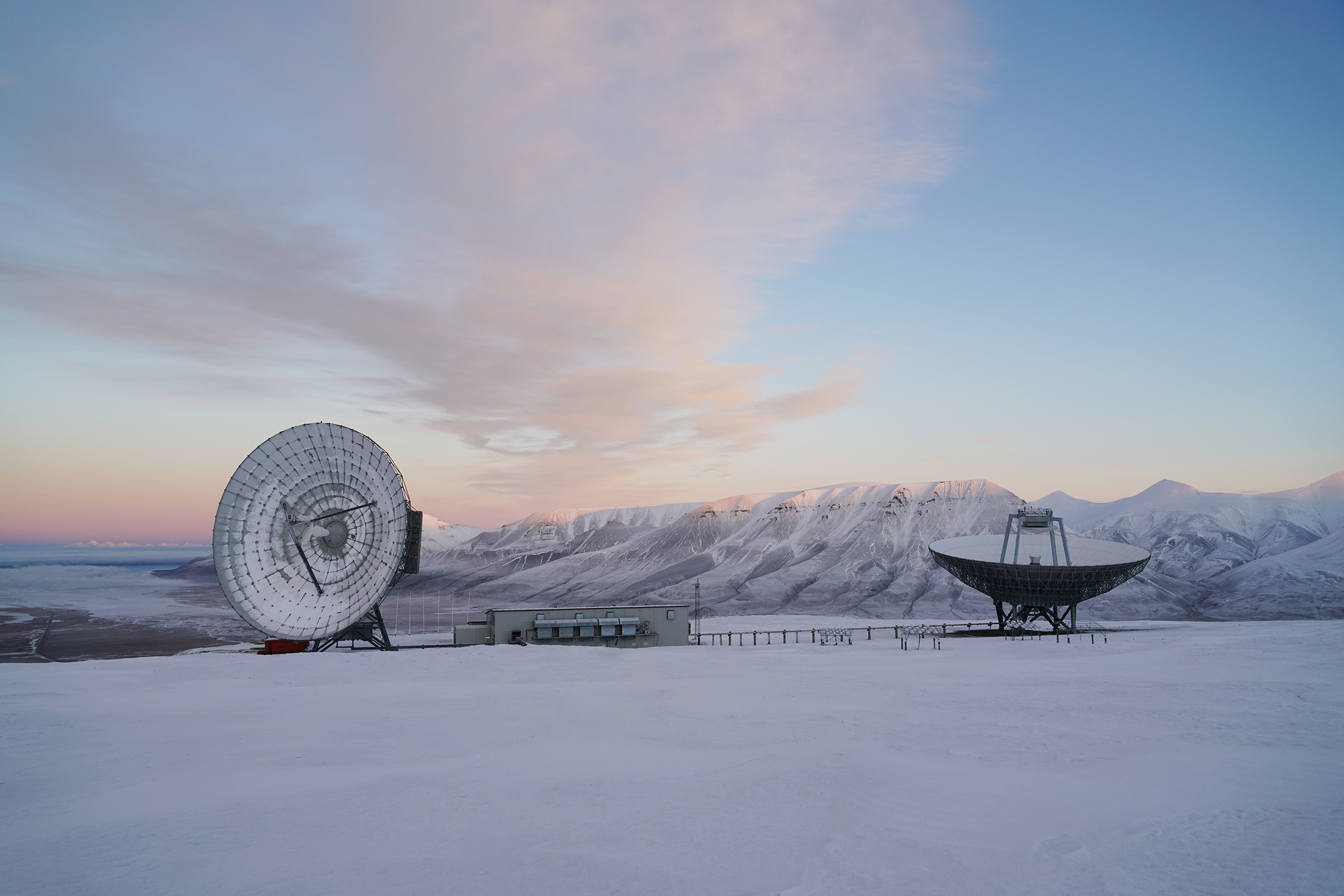 EISCAT Svalbard Radar with pink winter skies.